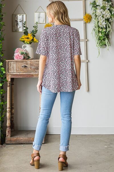 Heimish Full Size Short Sleeve Crisscross Animal Babydoll Top Plus